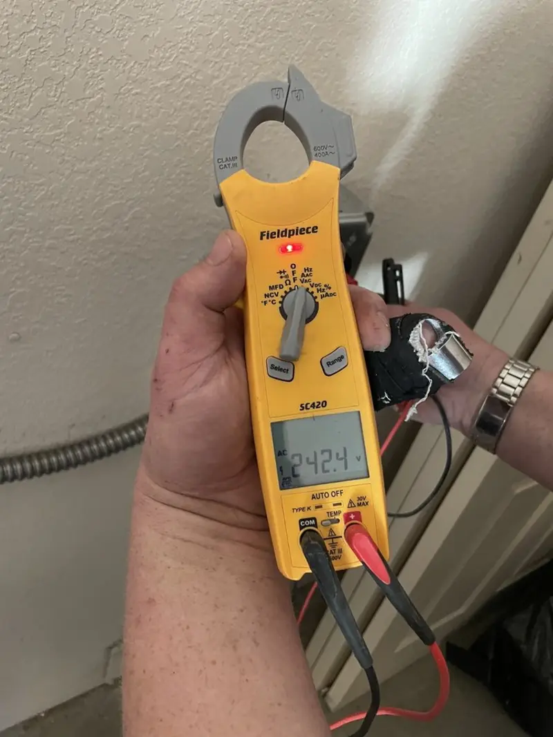 Voltage testing with clamp meter during Electrical Installation Services in Blaine